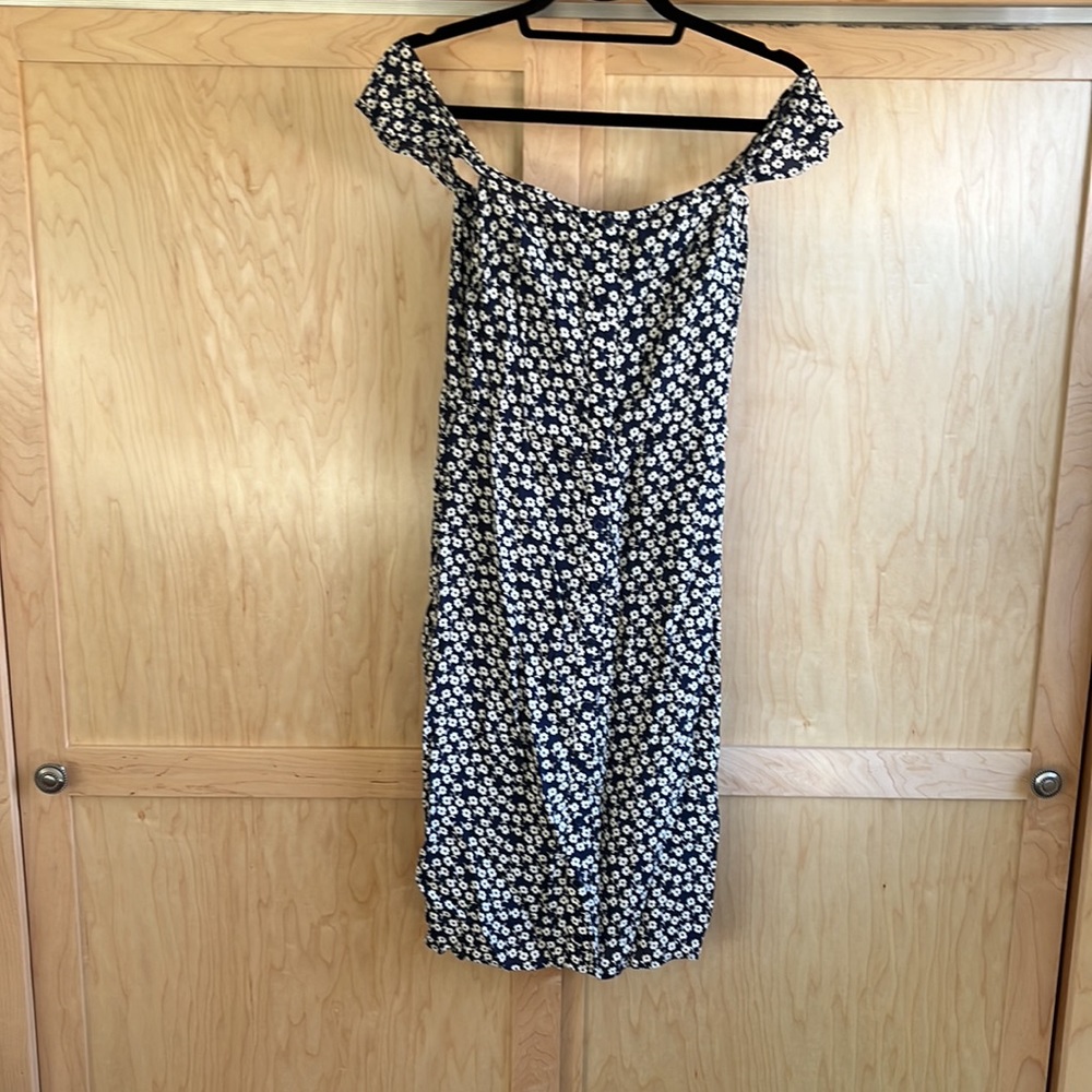Off the shoulder navy and white patterned Reformation knee length dress.